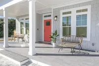 New Luxury heated pool home, steps to the beach with two master suites!
