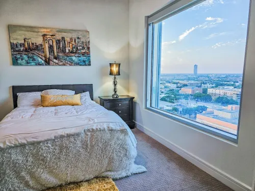 Downtown Luxury High-Rise Retreat: Panoramic City Views & Modern Amenities
