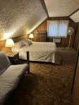 Cozy vacation home nestled in a quiet wooded area. Near town but private