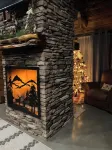 The Cozy Pines is a newly built, romantic log cabin with a 2-sided fireplace.