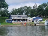 Relax by Lake of the Ozarks in your spacious Sunrise Beach retreat on 1 acre.