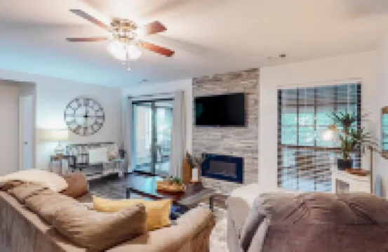 Deluxe condo with a screened patio, electric fireplace, pools, tennis, & gym