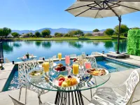 "Luxury Lakefront Paradise: Heated Pool Haven with Unrivaled Views"