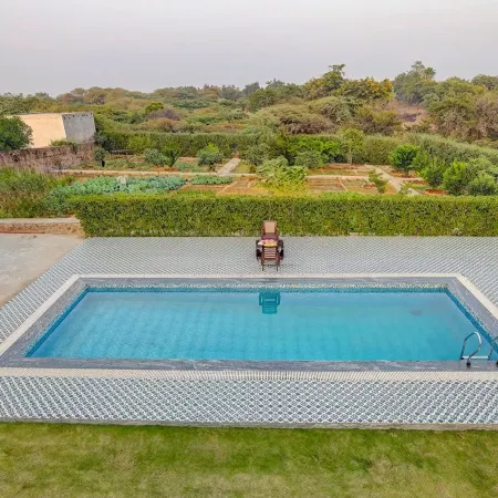 ELIVAAS Amaltas 4BHK Hideaway With Pool