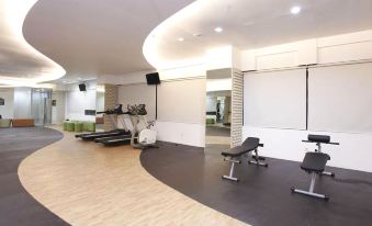 Modern Studio Grand Serpong Apartment by Travelio