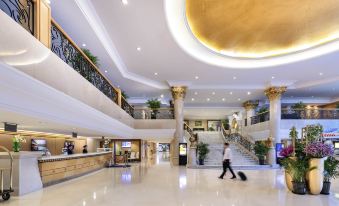 The modern appearance of the hotel is enhanced by its large lobby with multiple floors and a central atrium at Novotel Beijing Peace