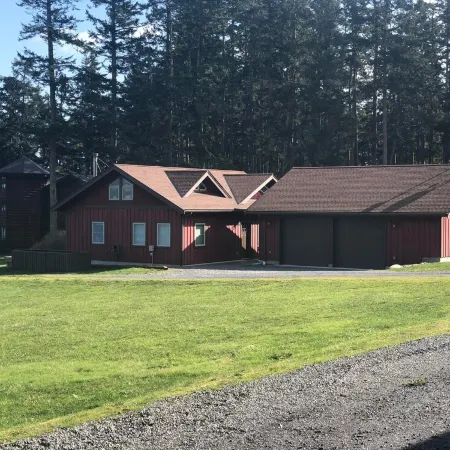 Beautiful farmhouse overlooking water with beach access on a private estate
