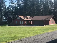 Beautiful farmhouse overlooking water with beach access on a private estate
