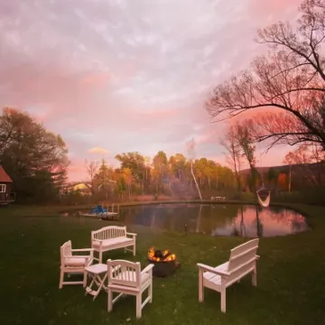 Home with a spring-fed pond and mountain view.