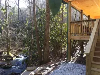 Log cabin nestled in the mountains and situated on Collett Creek