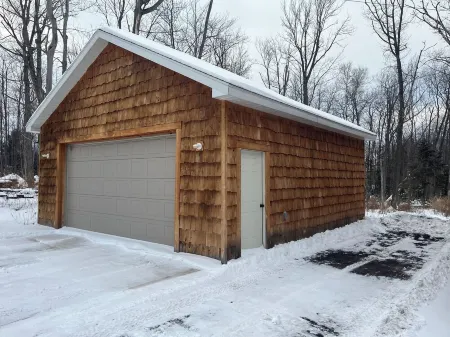 Six bedroom home with a hot tub, pool and an outdoor bar on a two acre lot.