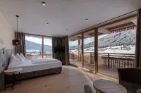 Alpine Nature Hotel Stoll Отели в г. Доббиако