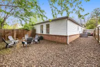 Backyard Fire Pit, Game Area and Cozy Seating - Charming Oasis Hotels in Fayetteville