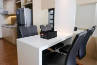 Homey and Cozy 2Br Apartment at Tamansari la Grande