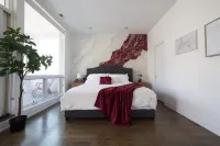 Urban Chic Rooftop Retreat with Balcony Views, Games, WiFi Hotels in Ukrainian Village