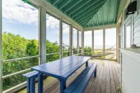 Visit Bald Head Island in March. Peaceful porches with stunning ocean view!