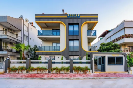 Zeluxe Suite Hotel Отели рядом с достопримечательностью «Актур Парк»