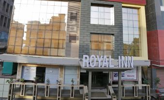 the exterior of the royal inn hotel , with its name displayed in white letters on the building at Royal Inn