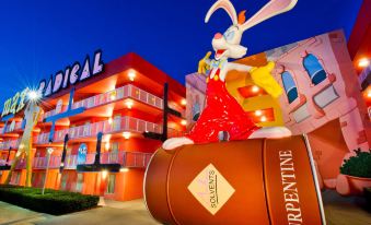"a large rabbit statue stands in front of a hotel building , with the name "" general "" and "" burpentine "" visible" at Disney's Pop Century Resort - Classic Years