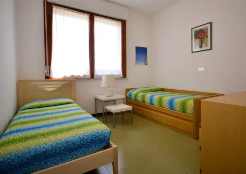 Moderno appartamento in un residence in stile resort con piscina