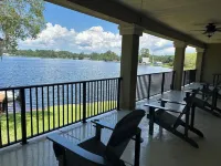 Lakeside Retreat~ Large home with pool, dock, game room and balcony on lakefront