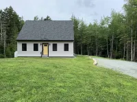 Newly built and fresh vacation home tucked in the woods of Mount Desert.