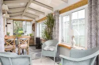 Quirky home with romantic shepherds' hut bedrooms and pretty garden near Padstow