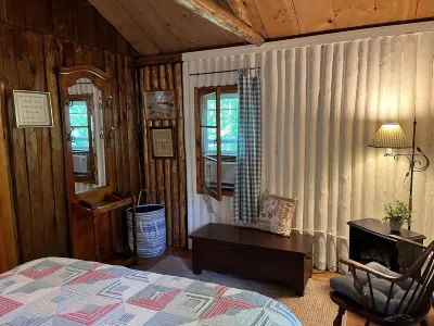 Quaint and cozy log  and knotty pine cabin close to lakes.