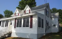 Winnipesaukee lakefront house includes slip, deck, hot tub & sleeps up to 11