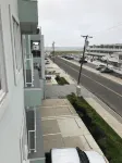 LUXURY MODERN BEACH BLOCK CONDO.  Rooftop Pool, Balcony with Ocean Views, Wi-fi