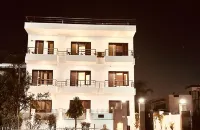 Hollyhocks Residency Hotels near Sanskriti Museum of Everyday Art