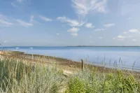 Stylish Patio and Firepit - Serene Beach Cottage Retreat