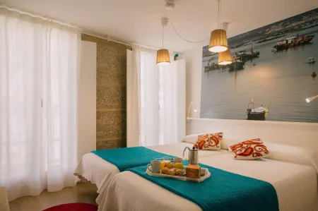 Roompedra Apartamentos turísticos Отели рядом с достопримечательностью «Miradoiro Costa Vella»