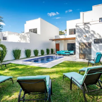 Ultramodern Townhome with an Inviting Coastal Design and Lush Outdoor Oasis with a Private Pool