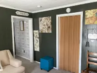 Updated bungalow with screened in porch  in rear.