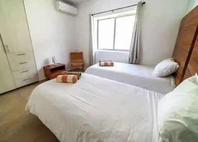 Airport condo w/ KING BED pool, security, kids game park + bbq area with lounge!