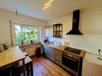 Spacious apartment with direct garden access, close to nature.