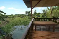 Tung's Tropika - with a wooden hut by a lake Hotels in Lahat