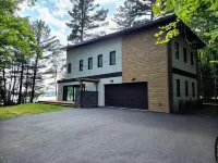 Luxury Lakefront designer-built property in Northwoods! 4 BDR, 10 Beds, 4 Bath