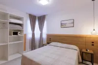 Le Village Flats e Hotel