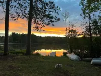 Serene cottage on private lake! Enjoy a private dock, fire pit, canoe, & more!