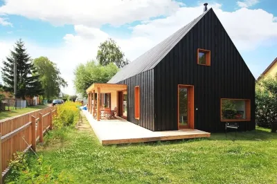 Modern wooden house on the Bodden with two apartments that can be combined