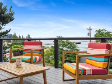 Darling pink beach house with epic views in a cozy community.