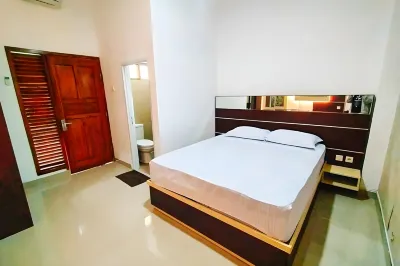 RedDoorz at Artomoro Guest House Hotel dekat Tugu GARUDA