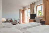 Hotel Tiefenbrunn Gardensuites & Breakfast Hôtels à : Postal