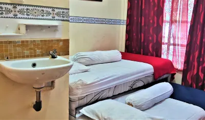 Katawa Guest House Syariah Hotels near Central General Hospital Dr. Mohammad Hoesin Emergency Room