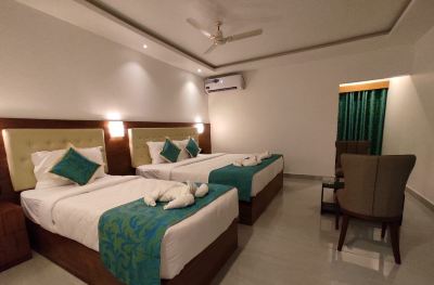 Deluxe Triple Room Hotel De Pebbles Photo