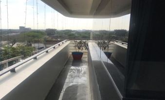 a view from an upper level of a building with multiple umbrellas and water features at The Heritage