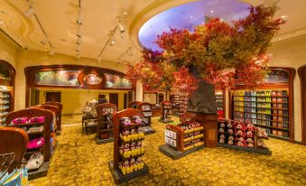 The indoor shopping center is a spacious room adorned with numerous items on the ceiling and in front at Shanghai Disneyland Hotel