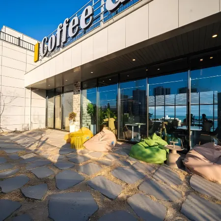 The Muse Hotel & Residence Отели рядом с достопримечательностью «Пляж Илгванг»